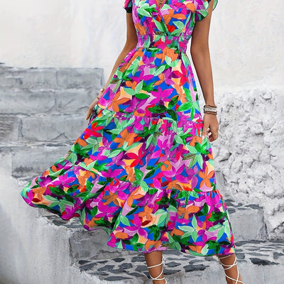Stilvolles Maxikleid mit Blumenmuster, V-Ausschnitt und gerafftem Rock