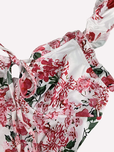 Figurbetontes Blumenmuster-Kleid mit Ärmeln, vorne zum Binden und rückenfrei