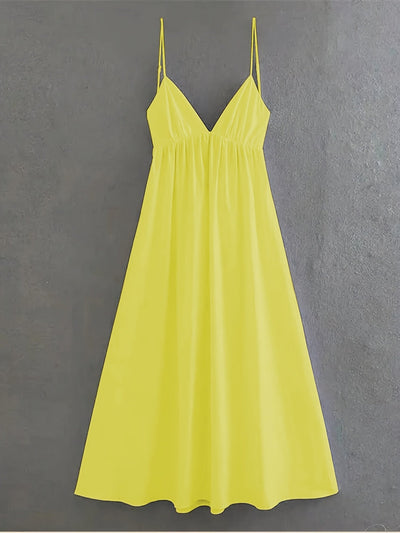Gelbes rückenfreies Sommerkleid mit dünnen Trägern